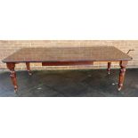 A VICTORIAN MAHOGANY EXTENDING DINING TABLE WITH THREE ADDITIONAL LEAVES the rectangular top with