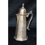 A SCOTTISH SILVER COFFEE POT The pot with octagonal base and rim, ebonised scroll handle, hallmarked