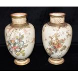 A PAIR OF DOULTON BURSLEM BALUSTER SHAPED VASES with floral and gilt decoration on a cream ground,