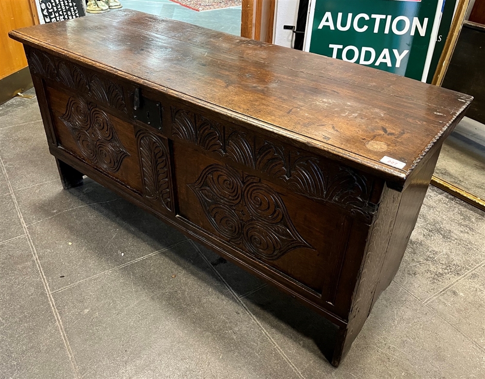 AN OAK COFFER the lid with chip carved decoration, the panelled front with carved decoration, - Image 2 of 6