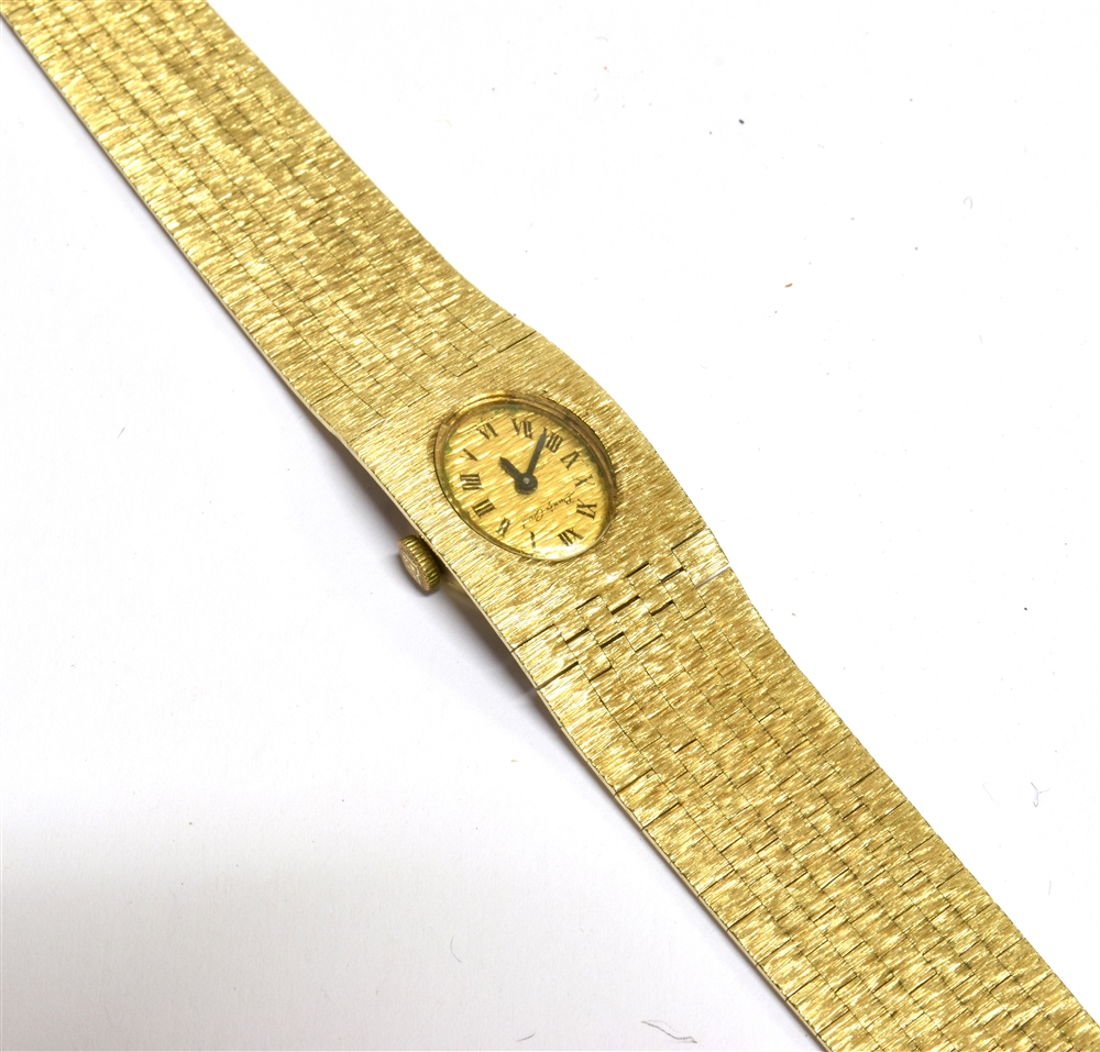 A 9CT GOLD LADIES WRISTWATCH The oval signed dial on an integral textured brick strap, the clasp - Image 2 of 4