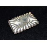 A VICTORIAN SILVER CARD CASE the case of embossed ribbed star burst design with central oval