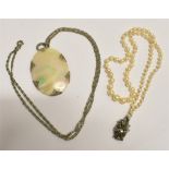A VINTAGE CULTURED PEARL NECKLACE with a mother of pearl pendant and chain, the cultured pearl