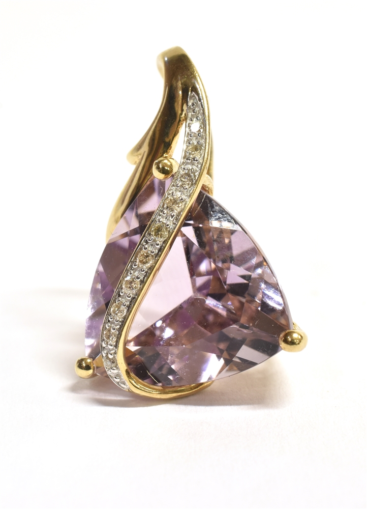 A 9CT GOLD, DIAMOND ACCENT PURPLE GARNET PENDANT PIECE the pendant of abstract design comprising a