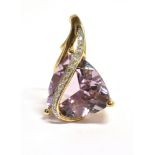 A 9CT GOLD, DIAMOND ACCENT PURPLE GARNET PENDANT PIECE the pendant of abstract design comprising a