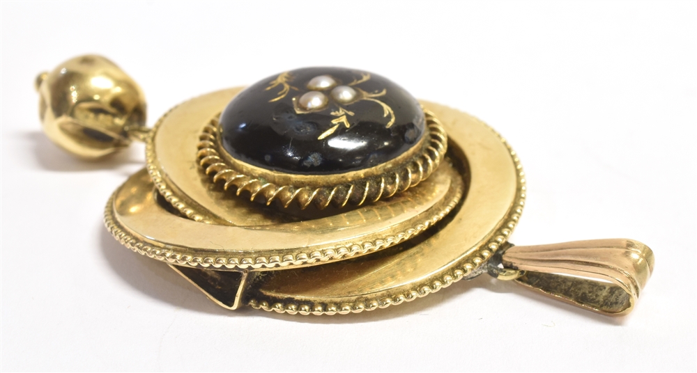 A LATE 19TH/EARLY 20TH CENTURY BLACK ENAMEL AND SEED PEARL PENDANT the circular pendant with bell