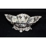 AN EDWARDIAN PIERCED SILVER BASKET The ornate open work basket with inlaid heart detail and on an