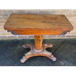A VICTORIAN ROSEWOOD TEA TABLE on tapering octagonal support with quatrefoil base and lion paw feet,