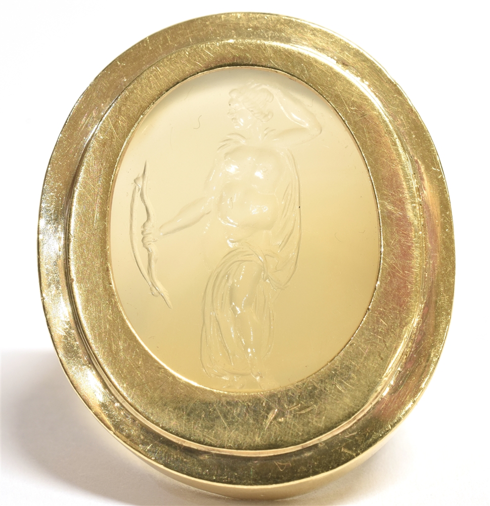 LARGE INTAGLIO SIGNET RING the intaglio in clear glass crystal carved with nude female Archer