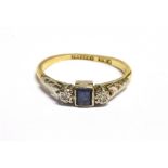 A VINTAGE 18CT GOLD PLATINUM DIAMOND AND SAPPHIRE DRESS RING The ring set with a central step cut