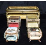 FIVE ASSORTED GILT METAL AND BEVELLED GLASS TRINKET BOXES the largest 29cm wide, 11cm deep, 11cm