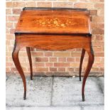 A GILT METAL MOUNTED ROSEWOOD BUREAU DE DAME with marquetry inlaid decoration, on cabriole supports,