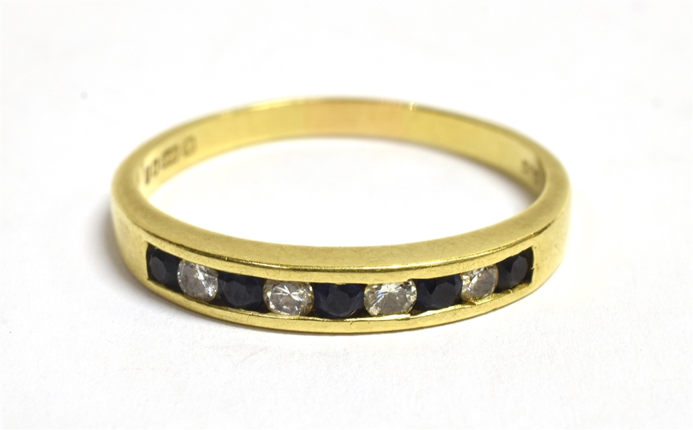 AN 18CT GOLD, DIAMOND AND SAPPHIRE HALF ETERNITY BAND RING Hallmarked London 1986, ring size T ½,