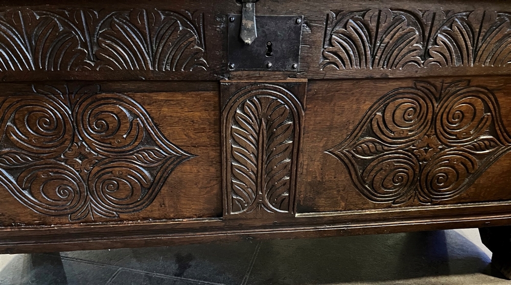 AN OAK COFFER the lid with chip carved decoration, the panelled front with carved decoration, - Image 3 of 6