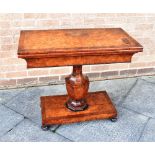 A VICTORIAN BURR WALNUT AND MAHOGANY CARD TABLE on vase shaped octagonal support, 84.5cm wide