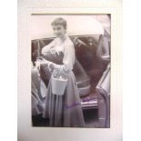 AUTOGRAPH - AUDREY HEPBURN, ACTRESS (BRITISH, 1929-1993) A black and white photograph, signed in