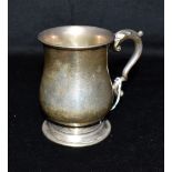 A GEORGE V SILVER TANKARD of plain form with scroll handle, hallmarked for Birmingham 1931, maker