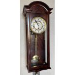 A MAHOGANY CASED WESTMINSTER CHIME WALL CLOCK the dial inscribed 'Comitti London', 25cm wide 69cm