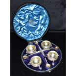 A CASED SET OF VICTORIAN SILVER SALTS the four salts on three hoof feet, beaded rim and chased