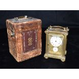 A FRENCH GILT METAL CASED CARRIAGE CLOCK the enamel dial signed 'ORANGE A PARIS', with subsidiary