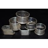 SIX ASSORTED SILVER NAPKINS RINGS Weight 245g, 7.8 Troy Oz