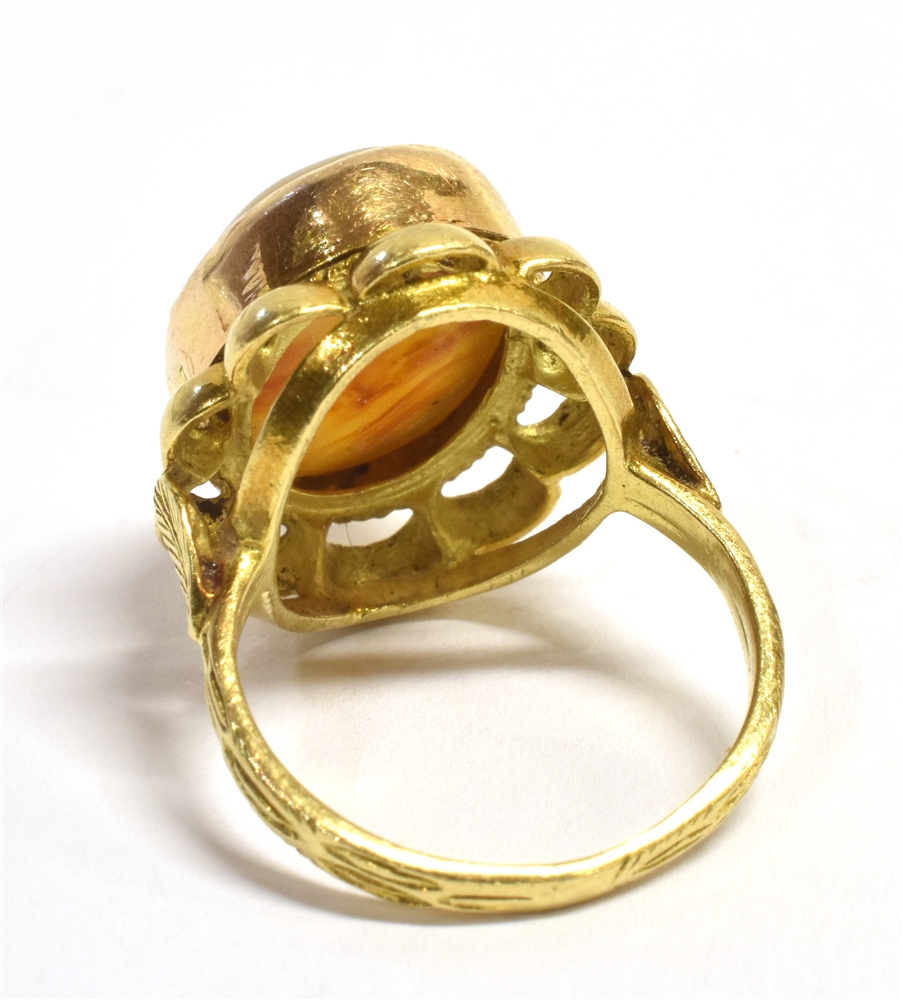 A STAMPED 18K MIDDLE EASTERN AQEEQ STONE RING the oval aqeeq stone, orange in colour with light grey - Image 3 of 3