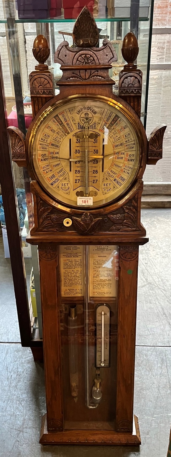 A LATE VICTORIAN OAK CASED ADMIRAL FITZROY BAROMETER the carved oak case enclosing a 10'