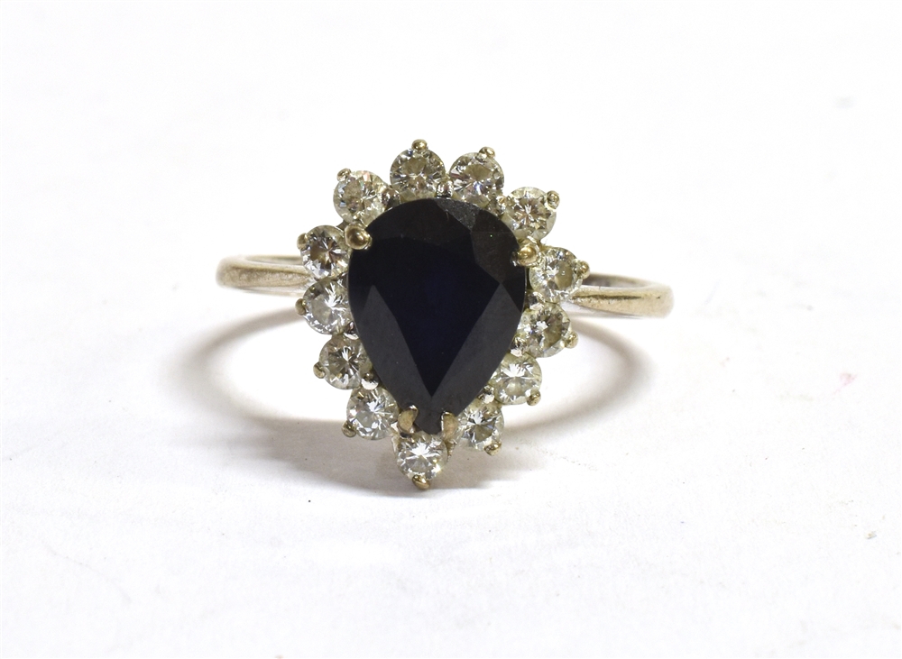 A STAMPED 18CT DIAMOND AND SAPPHIRE CLUSTER RING the facetted pear shaped sapphire measuring 10 x - Image 5 of 6