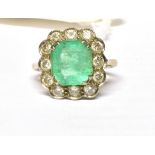 VINTAGE 18CT WHITE GOLD, EMERALD AND DIAMOND CLUSTER RING Octagon cut emerald measuring approx 9 x