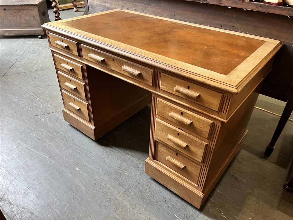 A TWIN PEDESTAL OAK DESK 121cm wide 68cm deep 76cm high