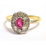 A DIAMOND CLUSTER RING the cluster centrally set in white metal featuring a pink oval faceted stone,