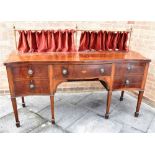 A LARGE EDWARDIAN SERPENTINE FRONT MAHOGANY SIDEBOARD with inlaid decoration, the central drawer