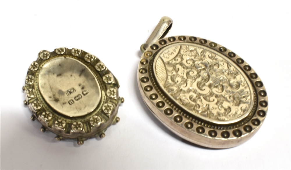 TWO EARLY 20TH CENTURY LOCKETS A silver locket, chased foliate front, applied pattern border, - Image 2 of 2