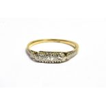 RETRO DIAMOND DRESS RING in narrow boat setting in white metal with three tiny diamonds on a