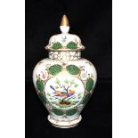 A DRESDEN LIDDED VASE the reserve painted with an exotic bird, 23cm high Condition Report : good