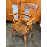 AN ELM AND BEECH BAR BACK WINDSOR ARMCHAIR on turned supports with H-shaped stretcher, initialled RH