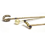 THREE VINTAGE STICK PINS to include a seed pearl and blue paste yellow metal stick pin (faded C T