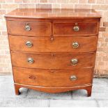 A MAHOGANY BOW FRONT CHEST OF TWO SHORT AND THREE LONG DRAWERS with inlaid decoration, 104cm wide