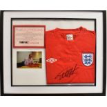 [FOOTBALL] GEOFF HURST, a signed England football shirt, with a colour photograph of a shirt being