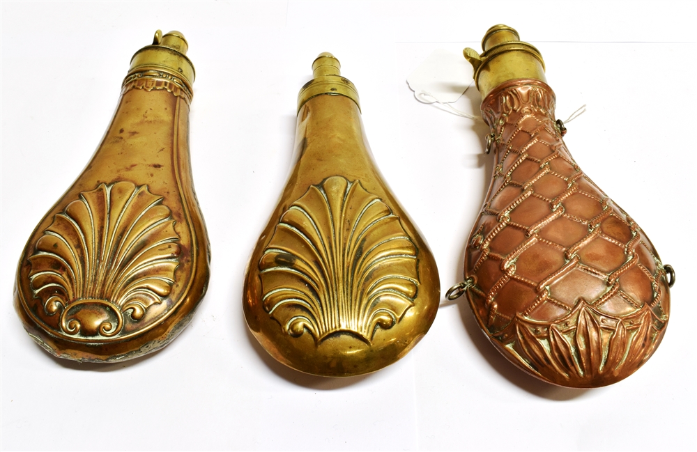 A COPPER POWDER FLASK with woven rope decoration in relief and with brass mount and two further