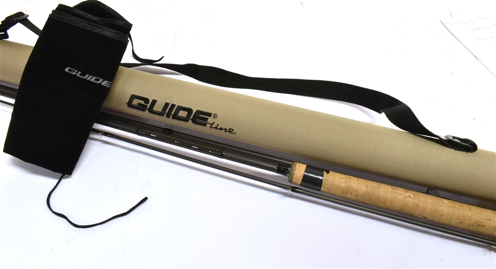 A 'GUIDELINE LPX' 12'6' THREE SECTION FISHING ROD with black cloth slip and 'Guideline' carrying