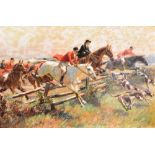 O.MERTE A hunt in full cry taking a post and rail fence, colour print, signed lower right with