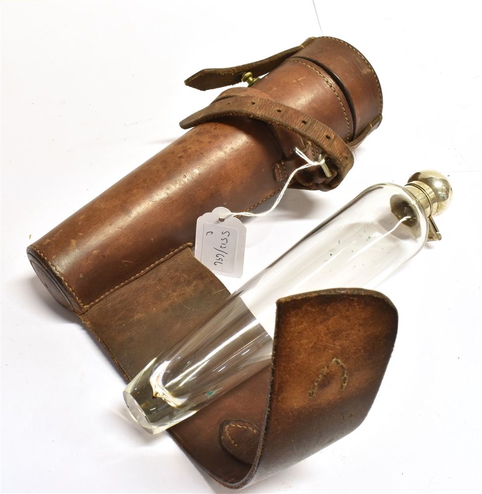 S513-696 A TAPERED GLASS FLASK with plated flip top in leather holder for saddle mounting, 26cm