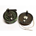 A 'SYSTEM 2 56L FISHING REEL With wire, diameter 7.5cm, together with a 'System TM TWO L' spare