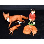 A BESWICK FIGURE OF A RUNNING FOX length 24cm, a smaller Beswick running fox, length 11cm, and