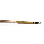 AN UNMARKED SPLIT CANE 8' TWO SECTION FLY ROD