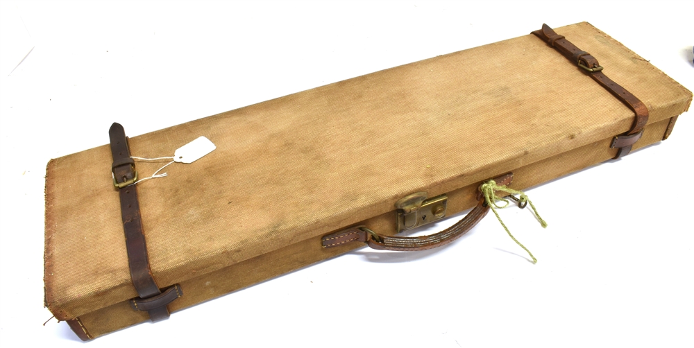 A RECTANGULAR CANVAS COVERED GUN CASE With pair of leather fastening straps and carrying handle