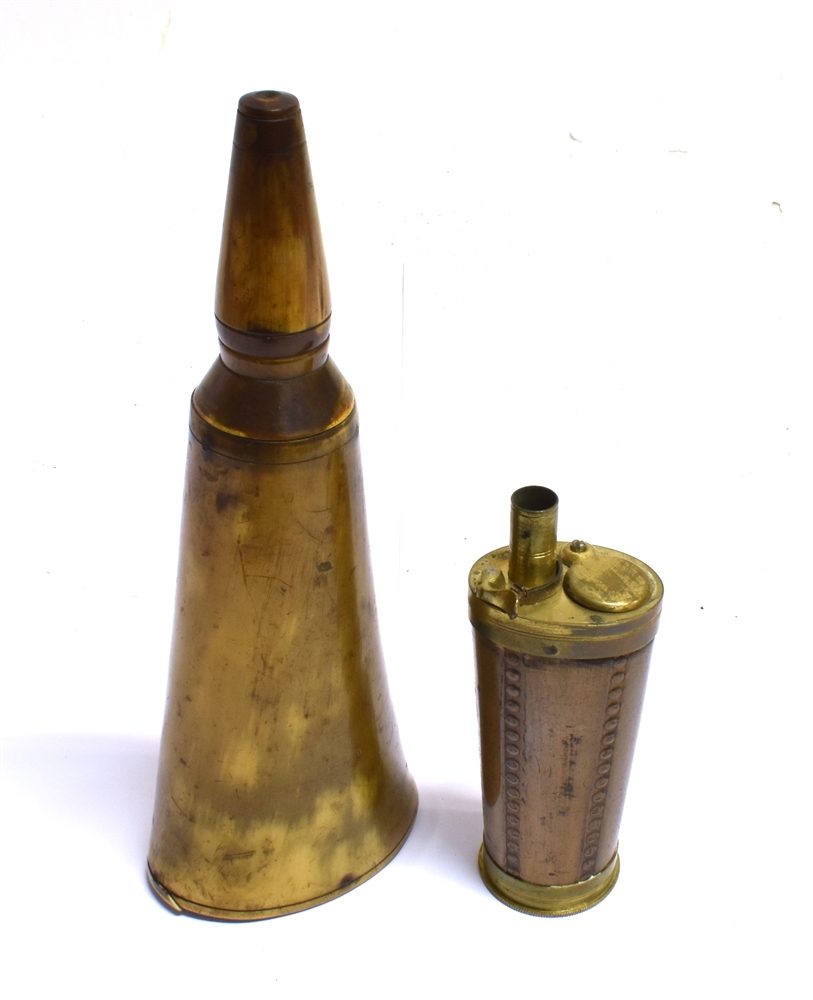 A HORN POWDER FLASK of tapering outline and a copper oval flask with brass mounts (2), the horn