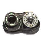 A GREYS GRX 9/11 FISHING REEL with line, diameter 10.5cm, together with spare spool with line,
