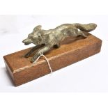AN EARLY TO MID 20th CENTURY SILVERED BRONZE MODEL of a running fox, 20cm long, mounted on an oak